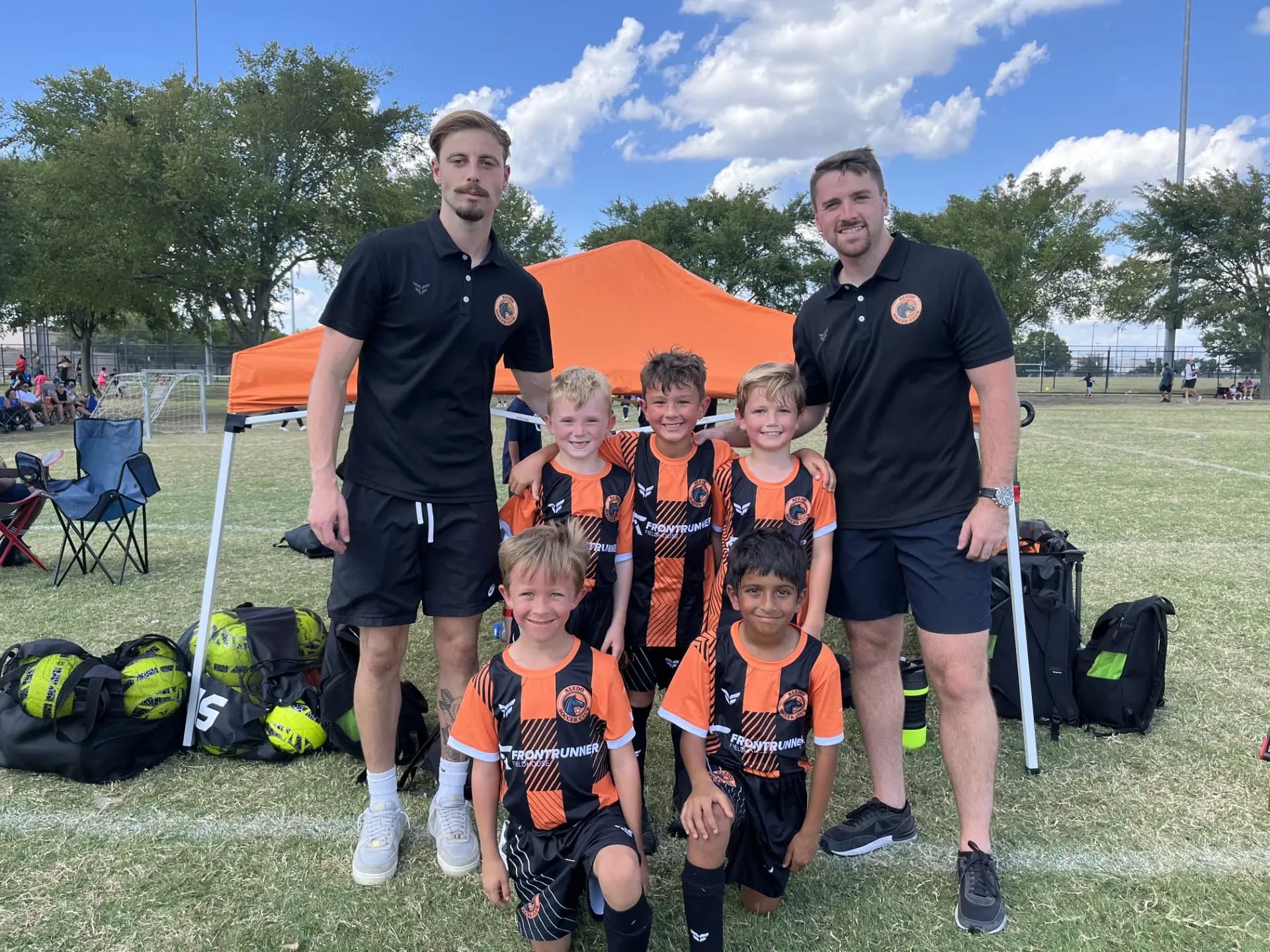 Aledo Soccer Club 4v4 team with their coaches on game day